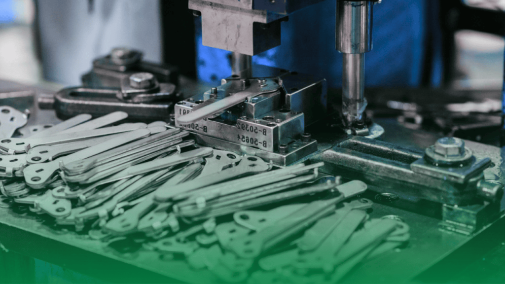 Stamping press with dies forming complex shapes and holes in sheet metal.