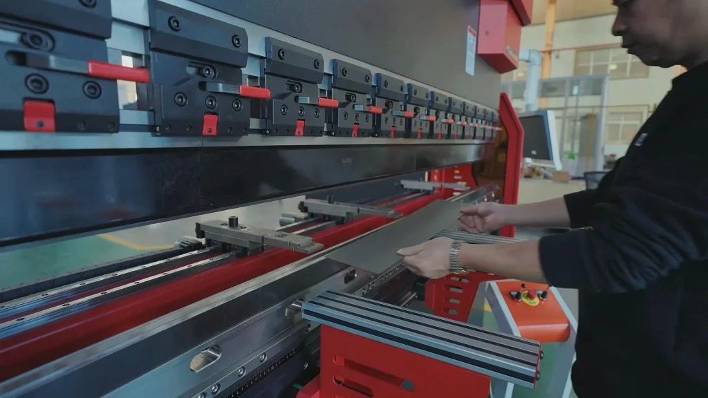 Workers at the sheet metal fabrication plant are performing bending operations.